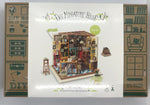 Cover of a kit featuring a completed model of a library/study.